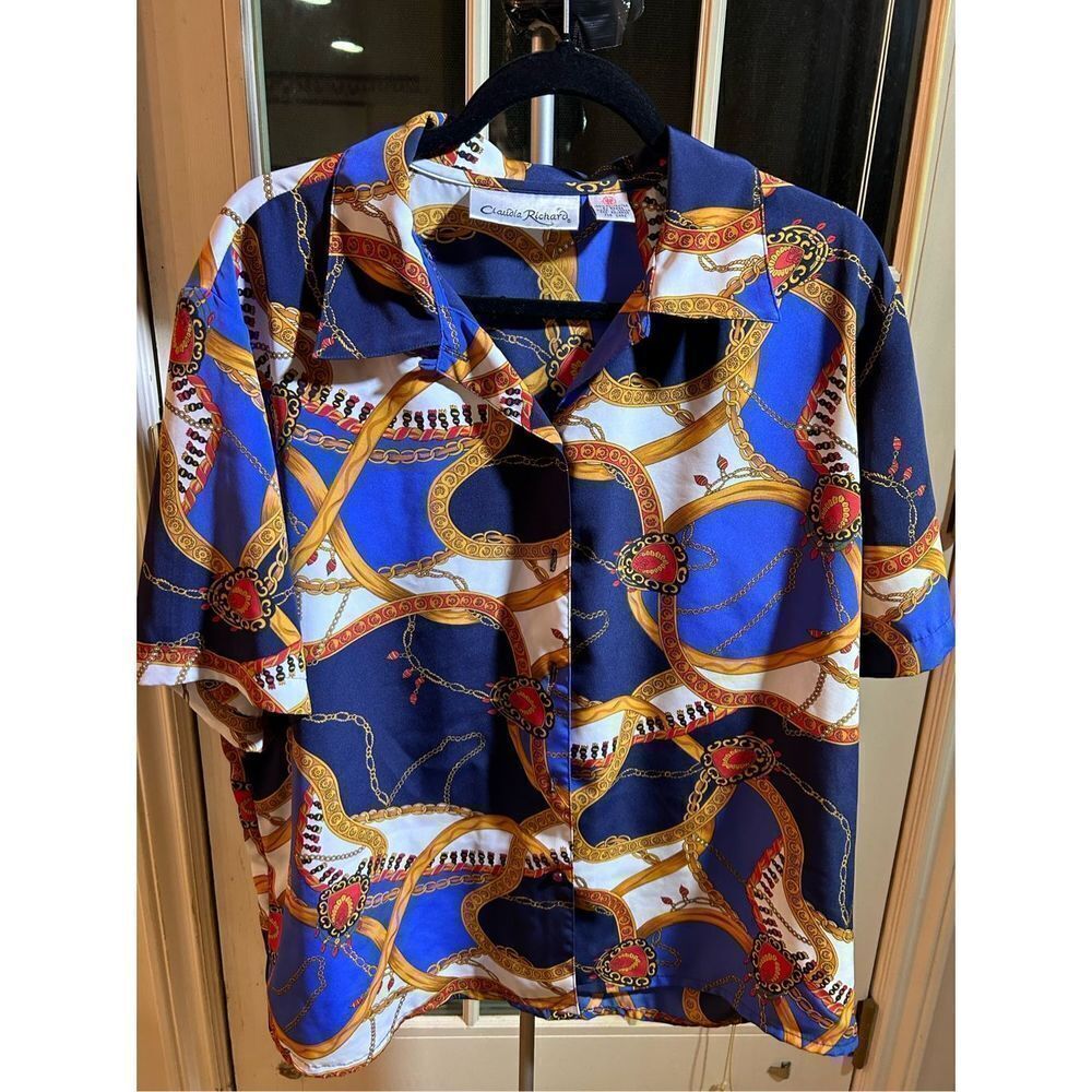 Button down short sleeve top. Silky feeling leopard. No size present likely XXL.